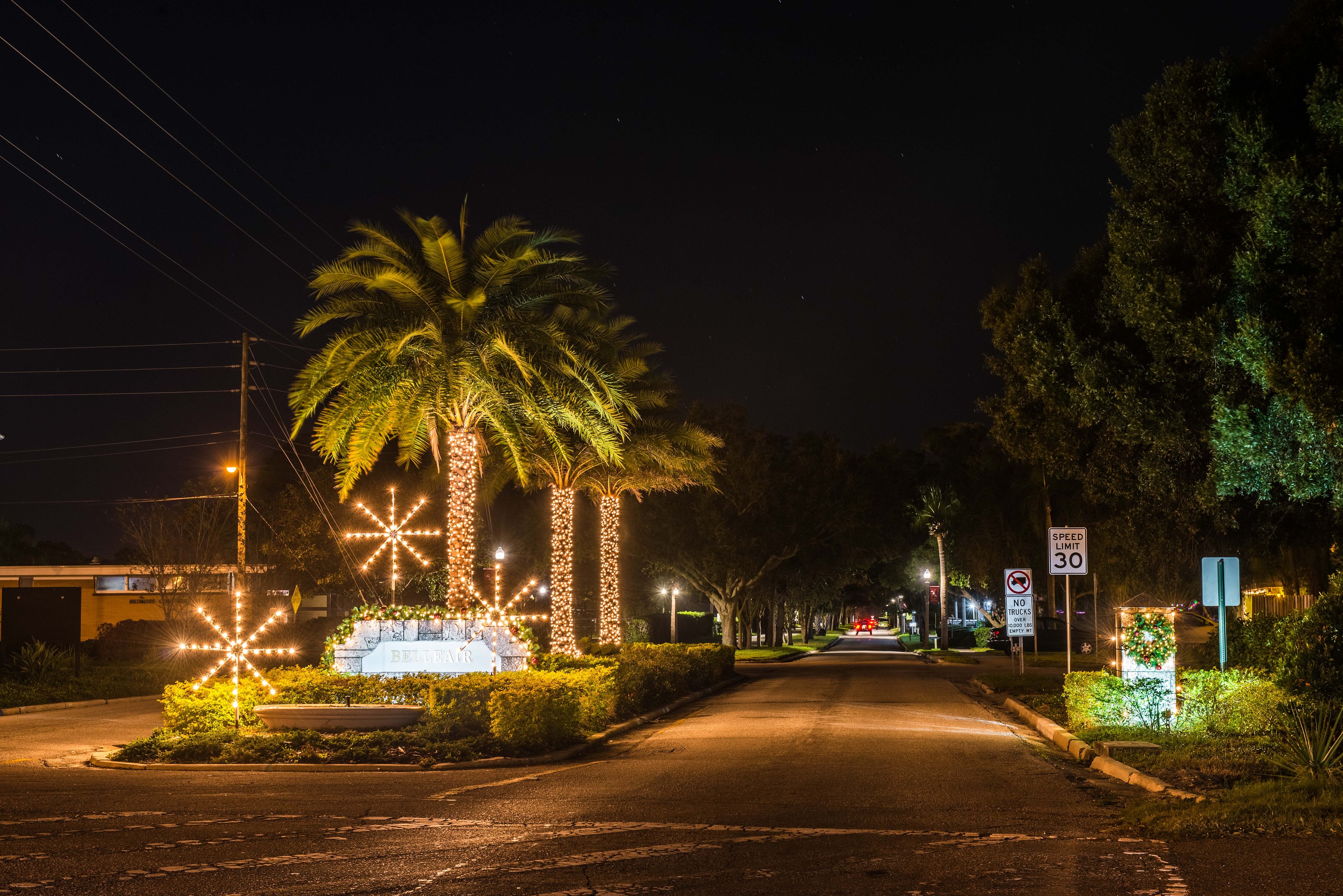 Holiday lighting on trees and in the median of Ponce de Leon Blvd next to the Belleair entrance sign