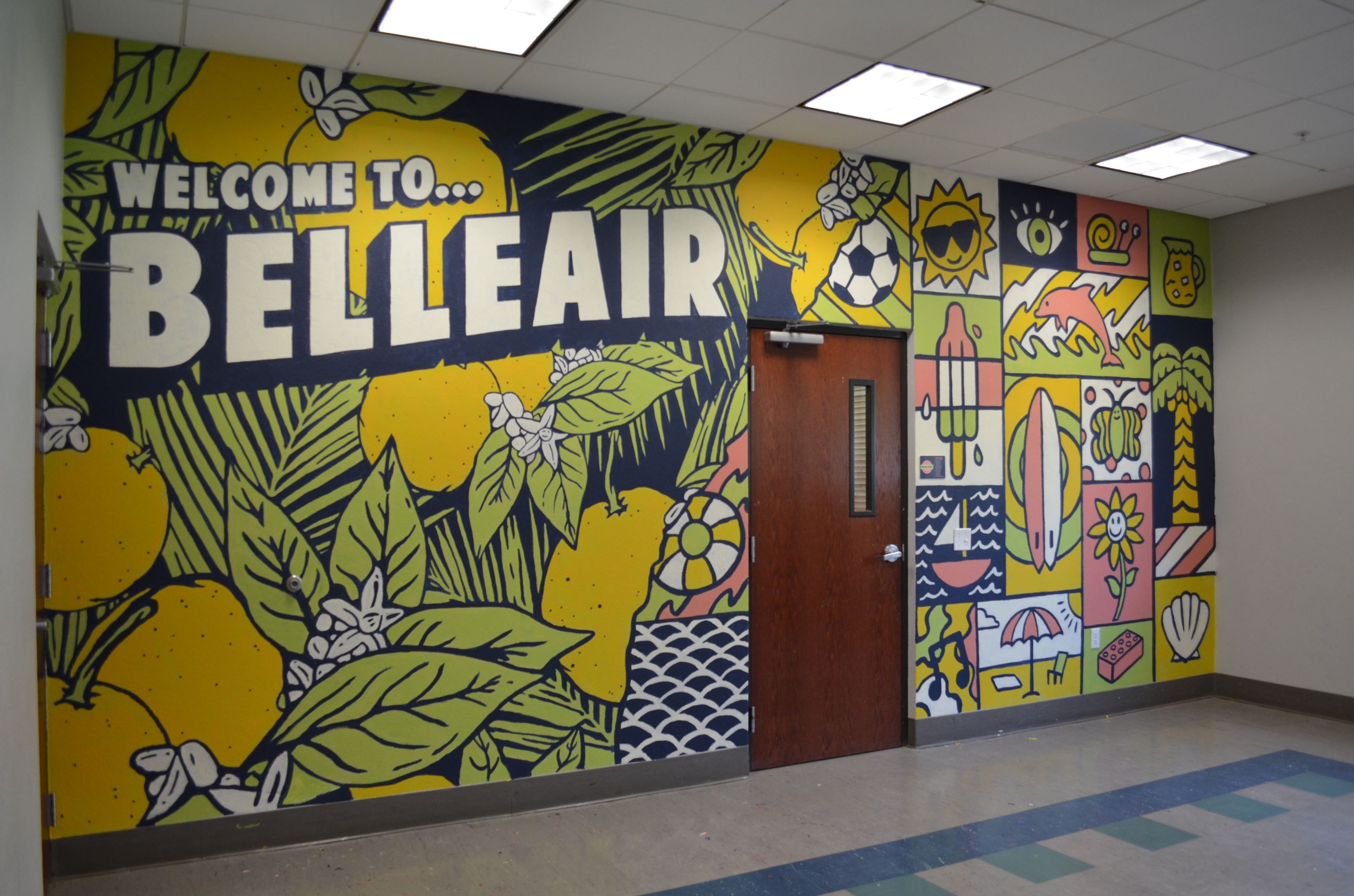 Welcome to Belleair mural wall with colorful oranges and flowers. 