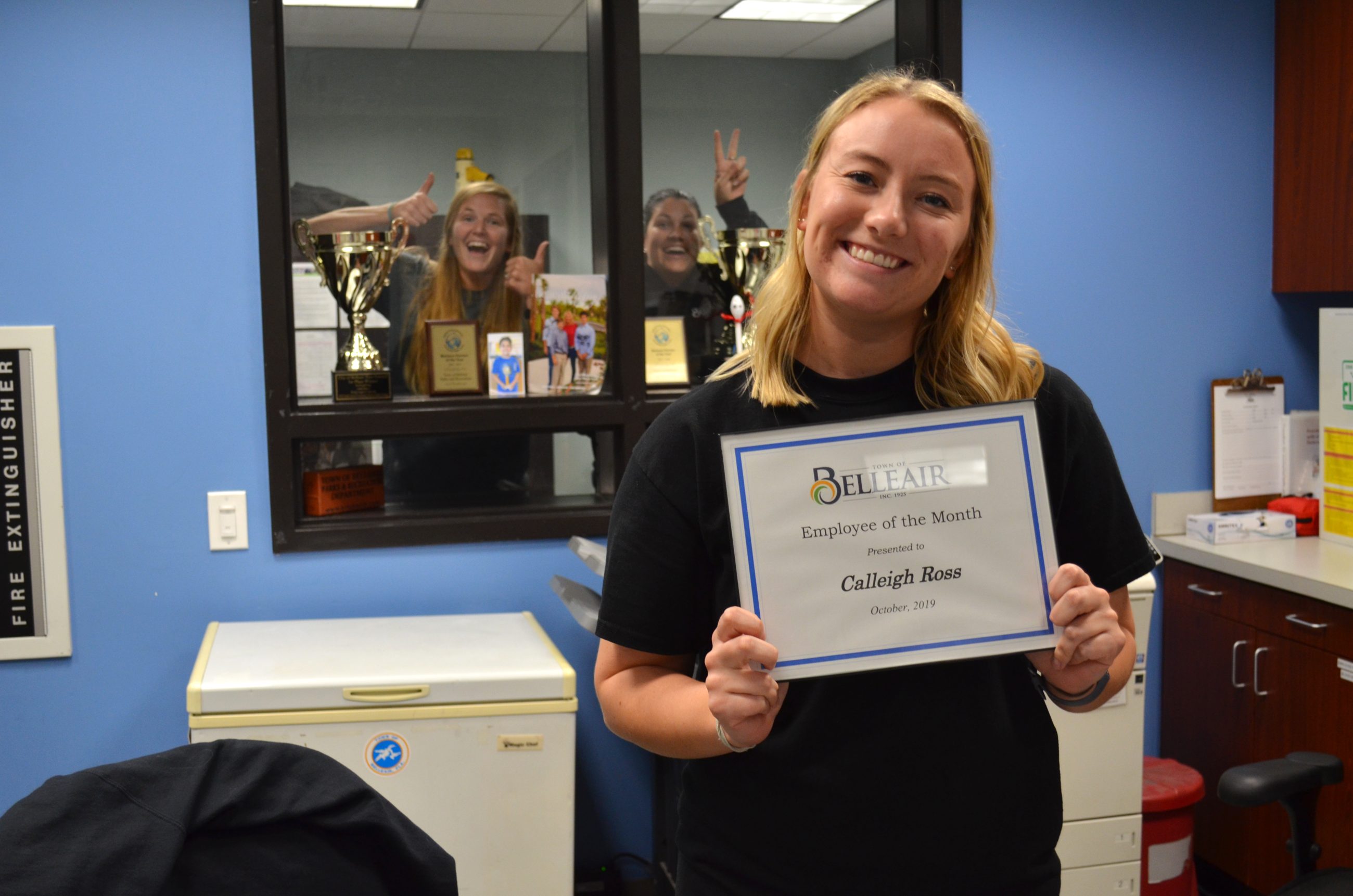 Calleigh Ross smiles with her Employee of the Month certificate at the Dimmitt Community Center fron