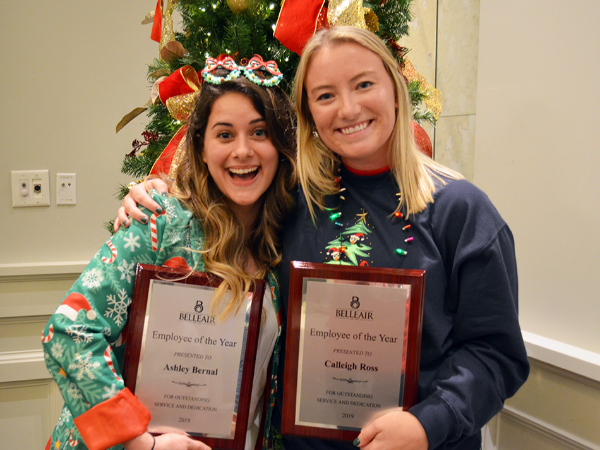 Ashley (left) and Calleigh (right) pose with their matching employee of the year plaques at the Bell