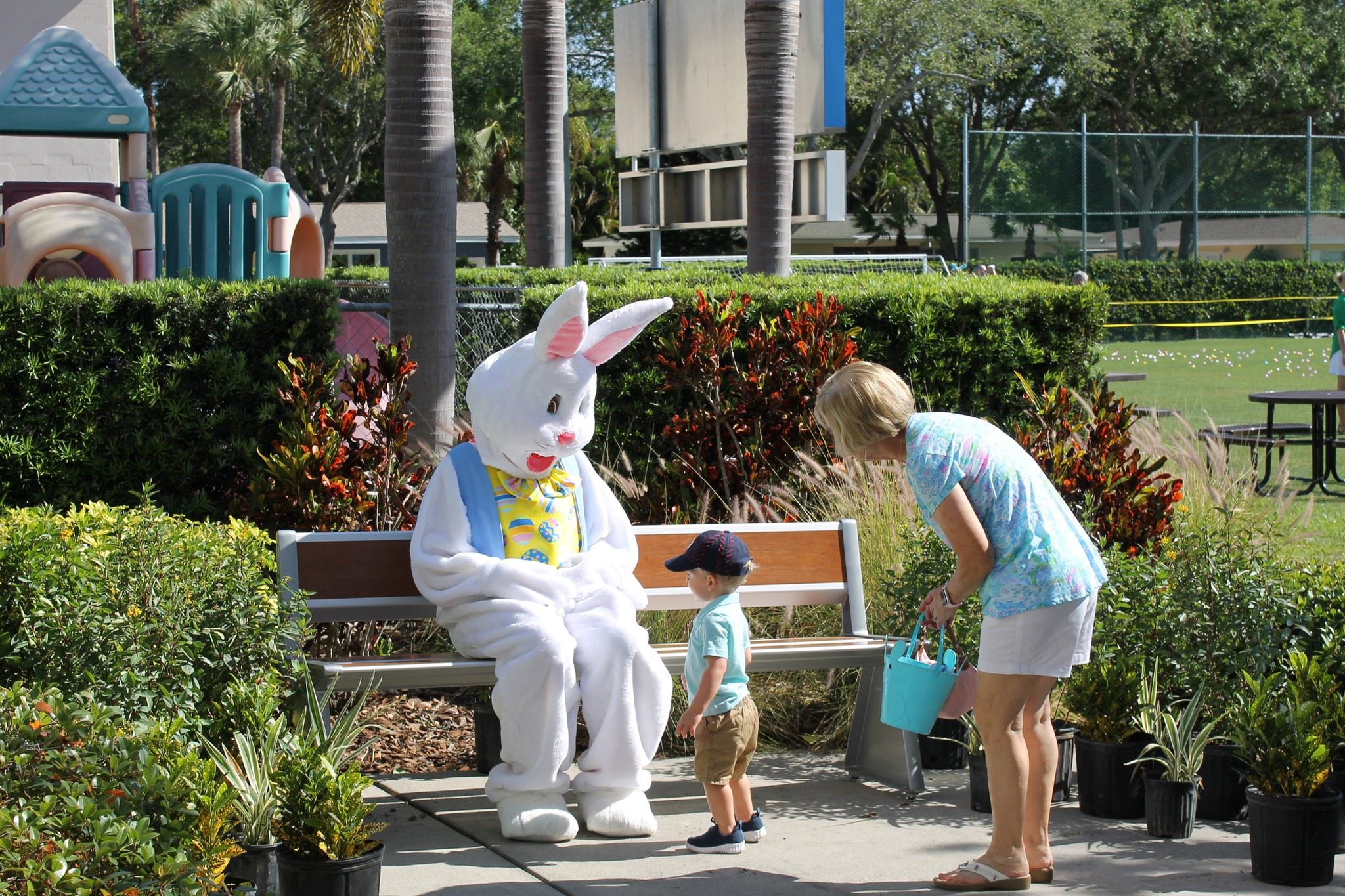 A little boy and his grandmother visit with the Easter bunny. 